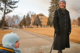 English professor Jessica Winston, right, and son, Robert, enjoy a liesurly stroll and wagon ride across Idaho State University's lower campus, Thursday, Jan. 30, 2014, in Pocatello, Idaho. Winston, who specializes in early modern literature and directs ISU's graduate studies in English, exclaimed she "felt like a celebrity with paparazzi following" when she encountered several photo media students working on their class assignment. (ISU Photo/Terry Ownby)